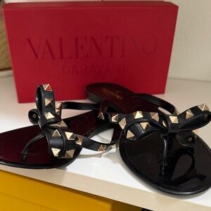 Valentino Garavani Black Jelly Bow Sandals with Gold Rockstuds